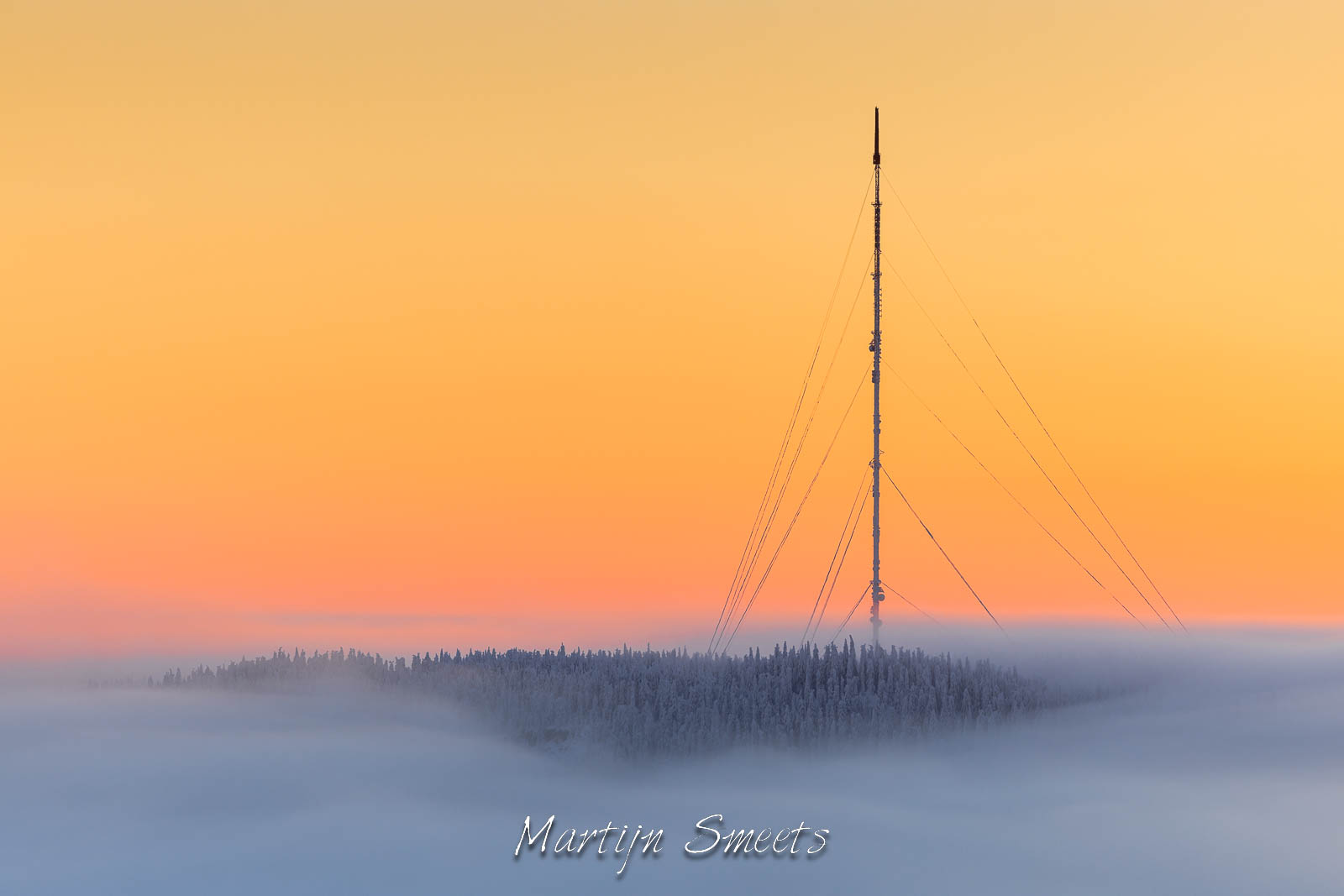 Sunset behind a big radio antenna in Finland.