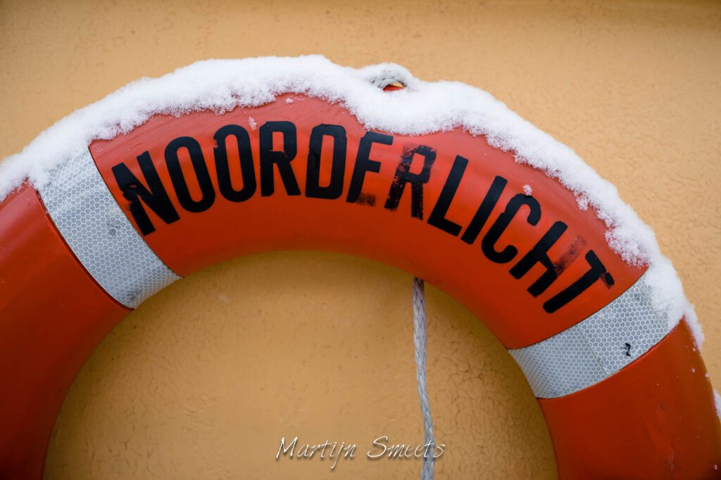 Snow on a life buoy of s/v Noorderlicht